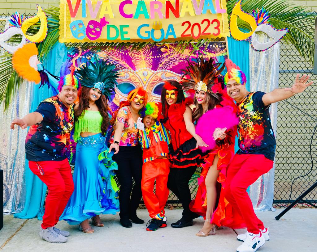 Viva Carnaval masquerade celebration troupe in vibrant feathered attire